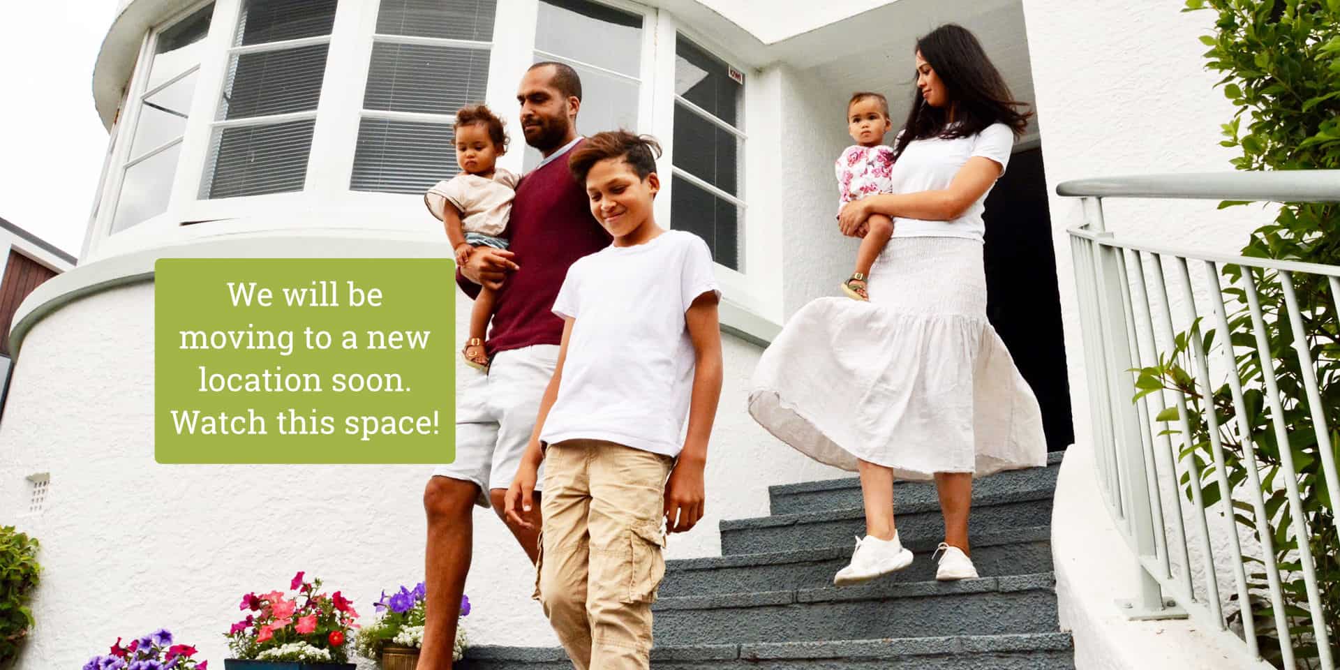 Family coming down steps with notice about changing location